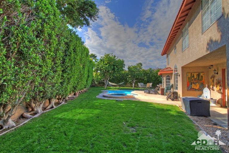 68565 Senora Road Cathedral City, CA 92234 - Photo 33 of 37 a view of a patio with table and chairs and potted plants