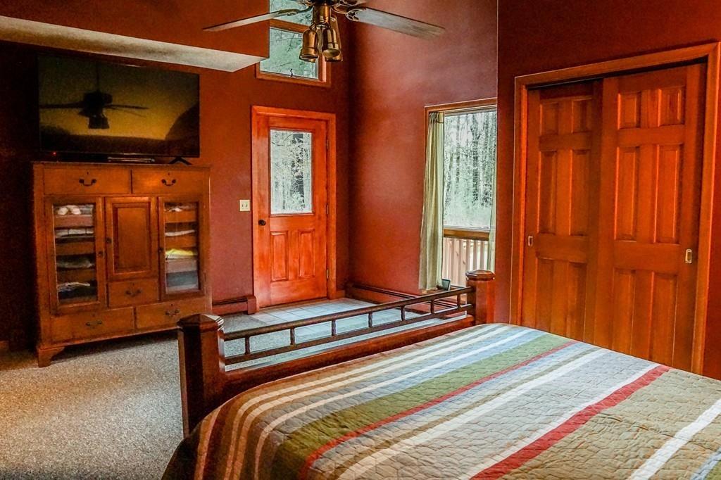 33 Murphy Road North Brookfield, MA 01535 - Photo 17 of 30 a bedroom with a bed and large windows