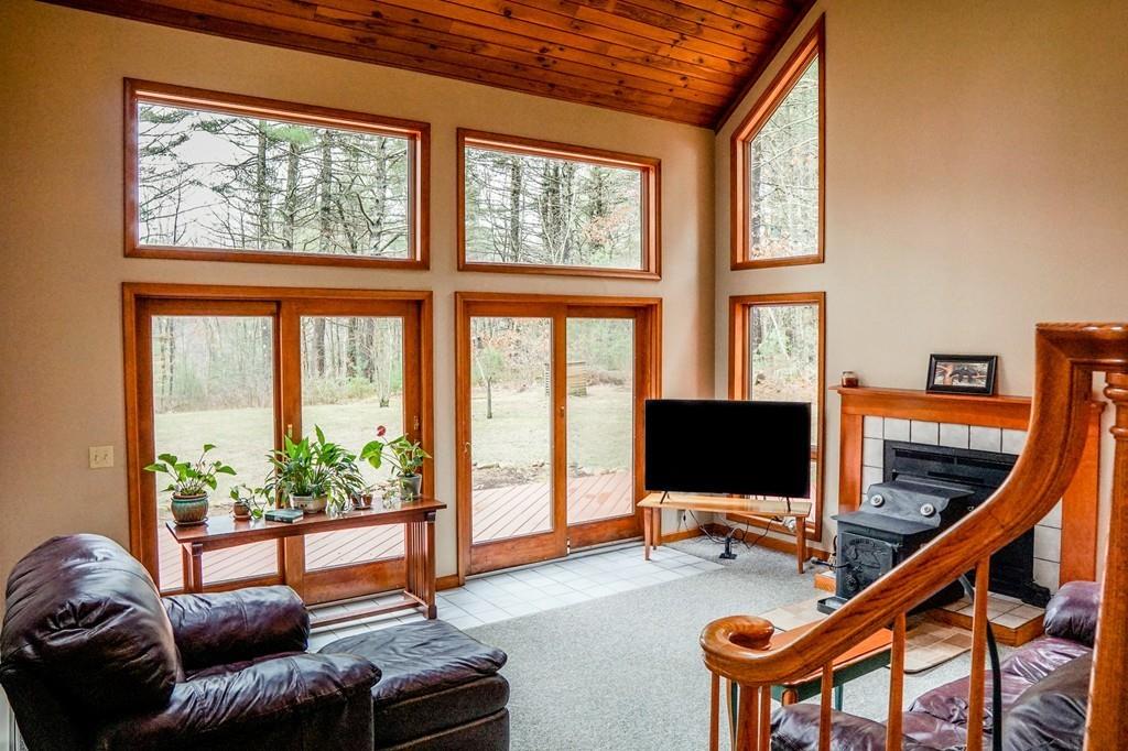 33 Murphy Road North Brookfield, MA 01535 - Photo 8 of 30 a living room with furniture a flat screen tv and a large window