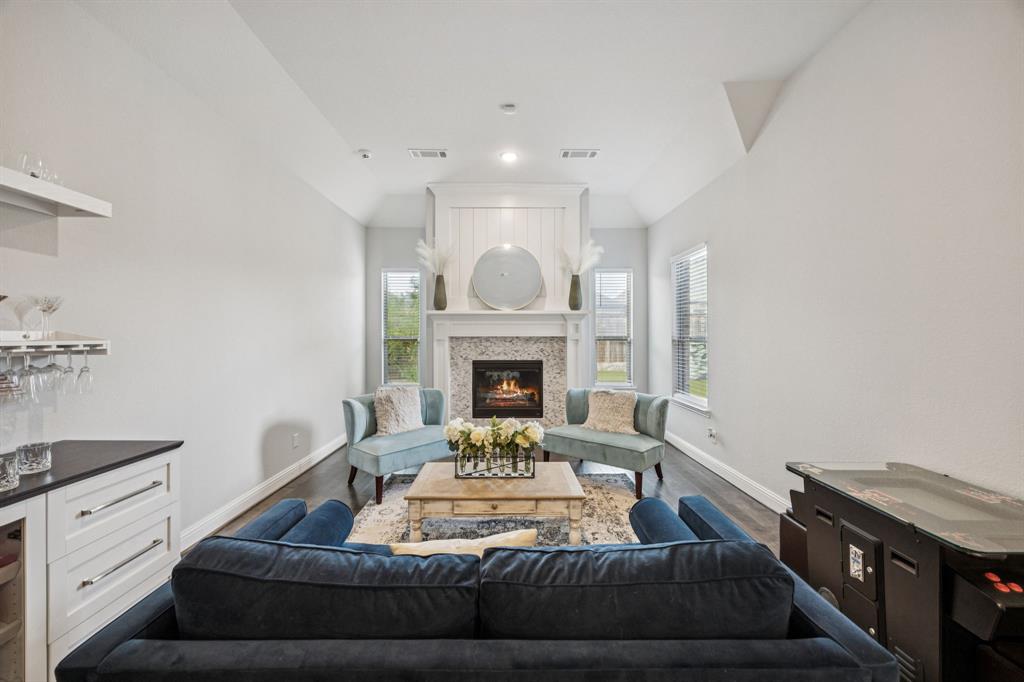 8116 Tramore The Colony, TX 75056 - Photo 13 of 36 a living room with furniture and a fireplace