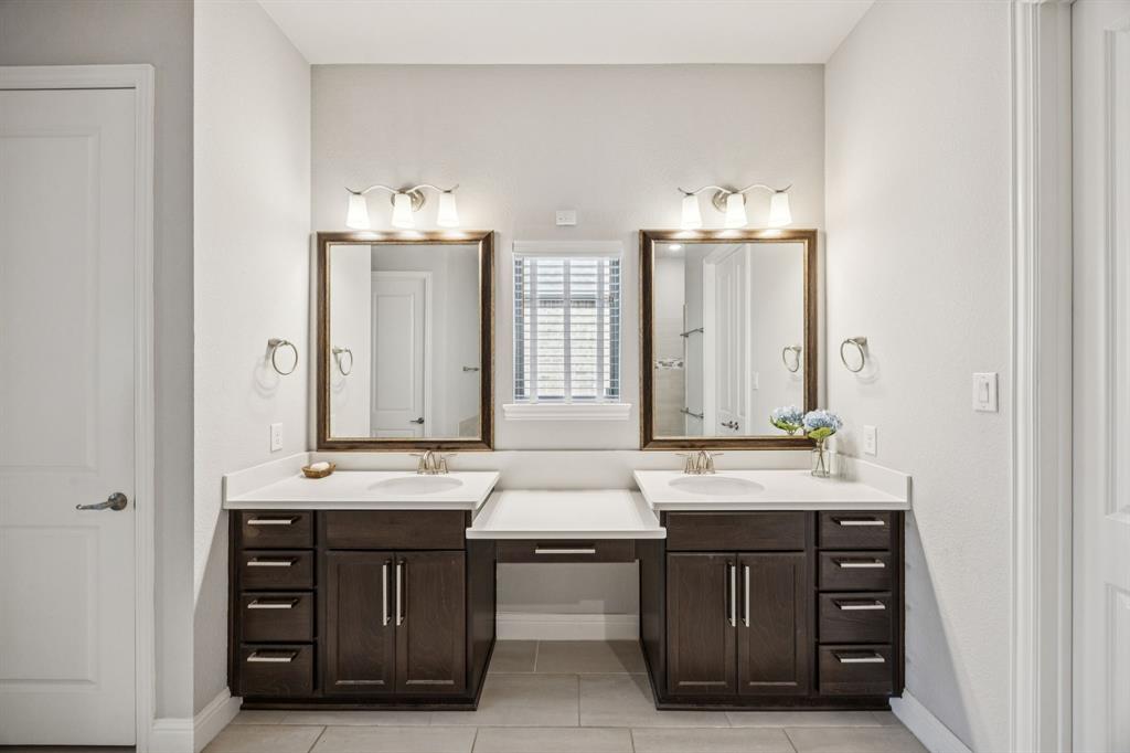 8116 Tramore The Colony, TX 75056 - Photo 17 of 36 a bathroom with a sink double vanity and a mirror