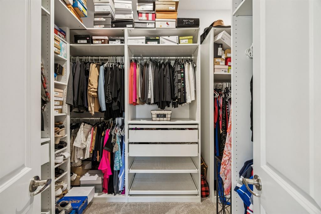 8116 Tramore The Colony, TX 75056 - Photo 19 of 36 a view of walk in closet with clothes and shoes