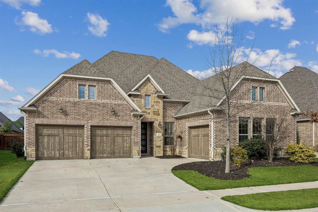 8116 Tramore The Colony, TX 75056 - Photo 2 of 36 a front view of a house with garden