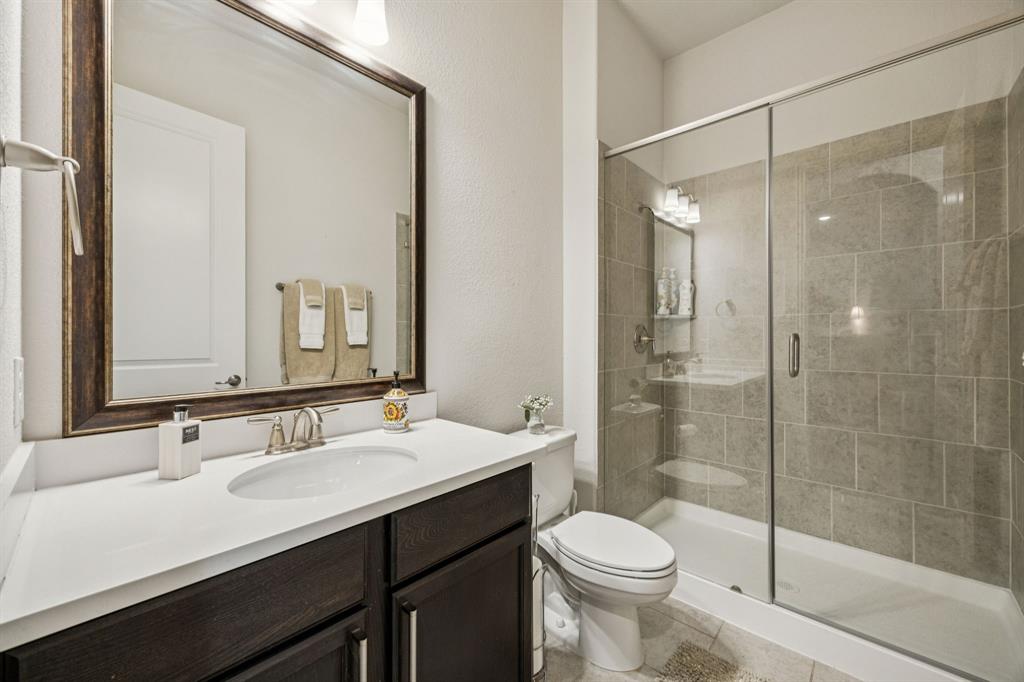 8116 Tramore The Colony, TX 75056 - Photo 23 of 36 a bathroom with a sink toilet and shower