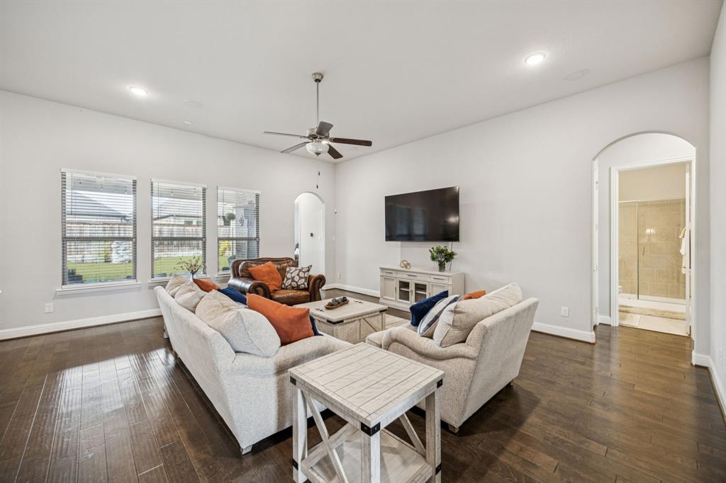 8116 Tramore The Colony, TX 75056 - Photo 4 of 36 a living room with furniture and a flat screen tv