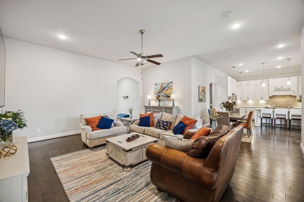 8116 Tramore The Colony, TX 75056 - Photo 6 of 36 a living room with furniture or wooden floor and a chandelier
