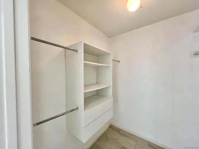a view of an empty walk in closet