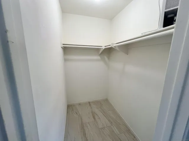 a view of an empty walk in closet