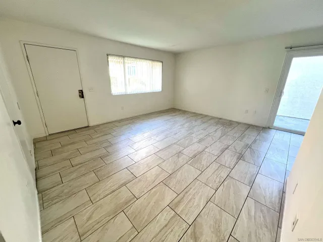 a view of an empty room and window