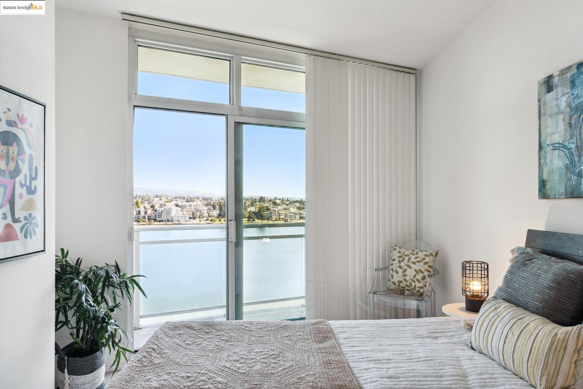 1 Lakeside Drive, Unit 1010 Oakland, CA 94612 - Photo 15 of 47 Bedroom featuring a water view and access to outside