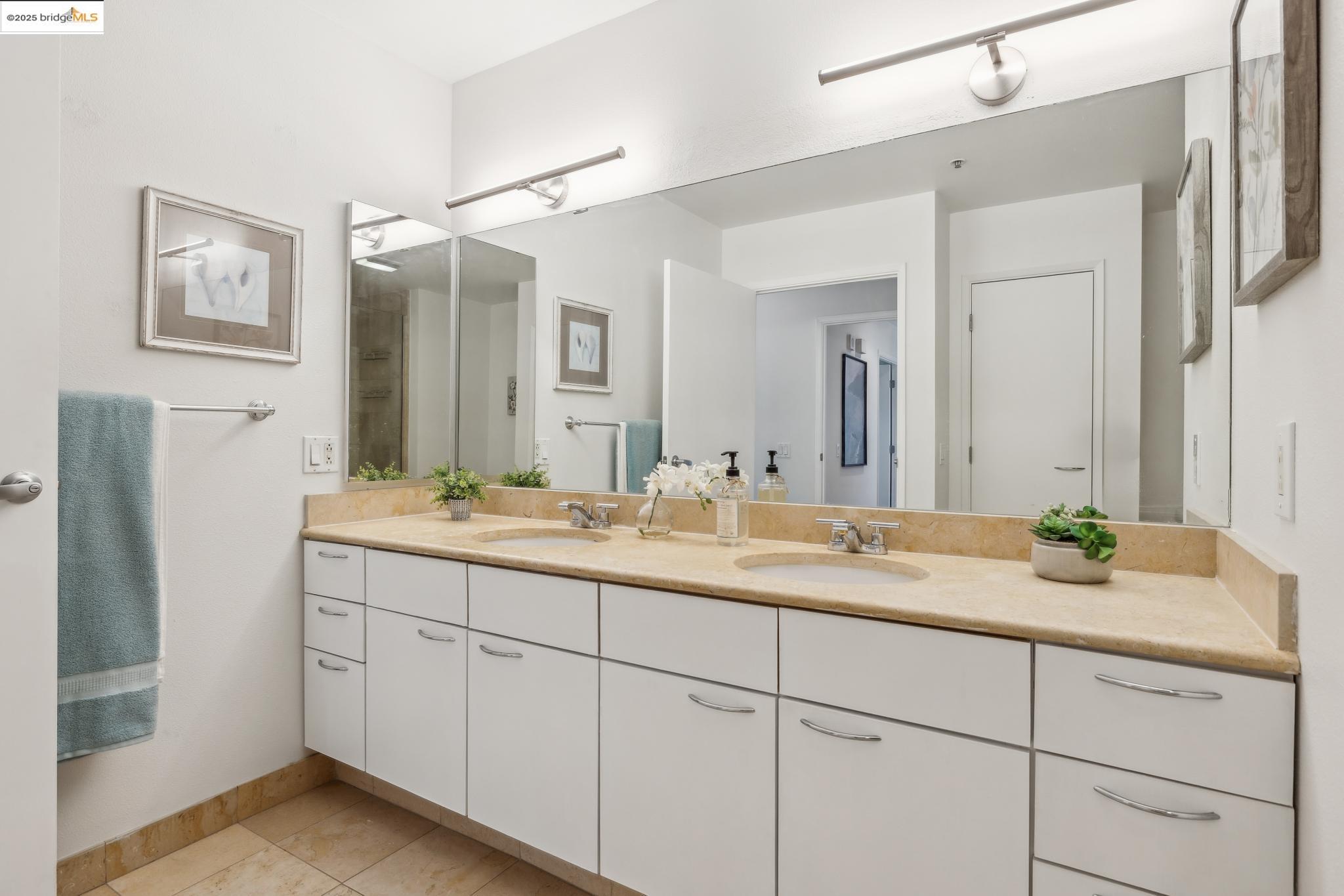 1 Lakeside Drive, Unit 1010 Oakland, CA 94612 - Photo 24 of 47 Bathroom with double vanity and light tile patterned flooring