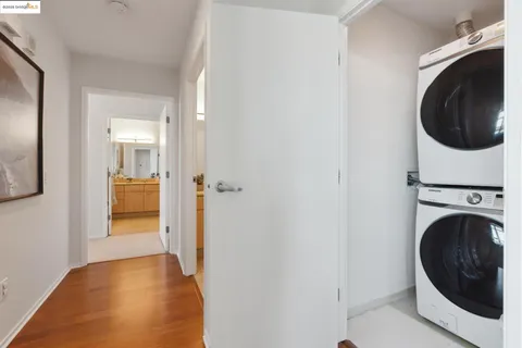 a view of a hallway with washer and dryer