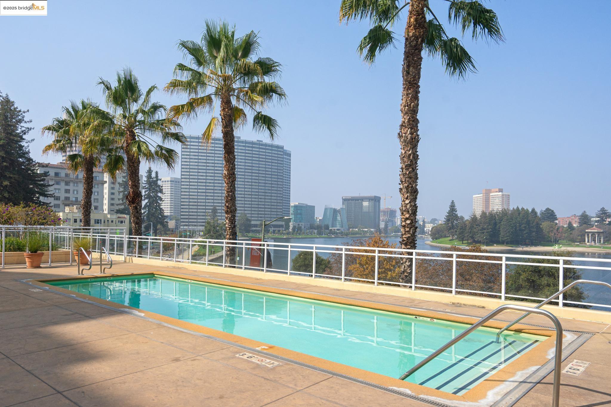 1 Lakeside Drive, Unit 1010 Oakland, CA 94612 - Photo 35 of 47 Community pool featuring a patio area and a city view