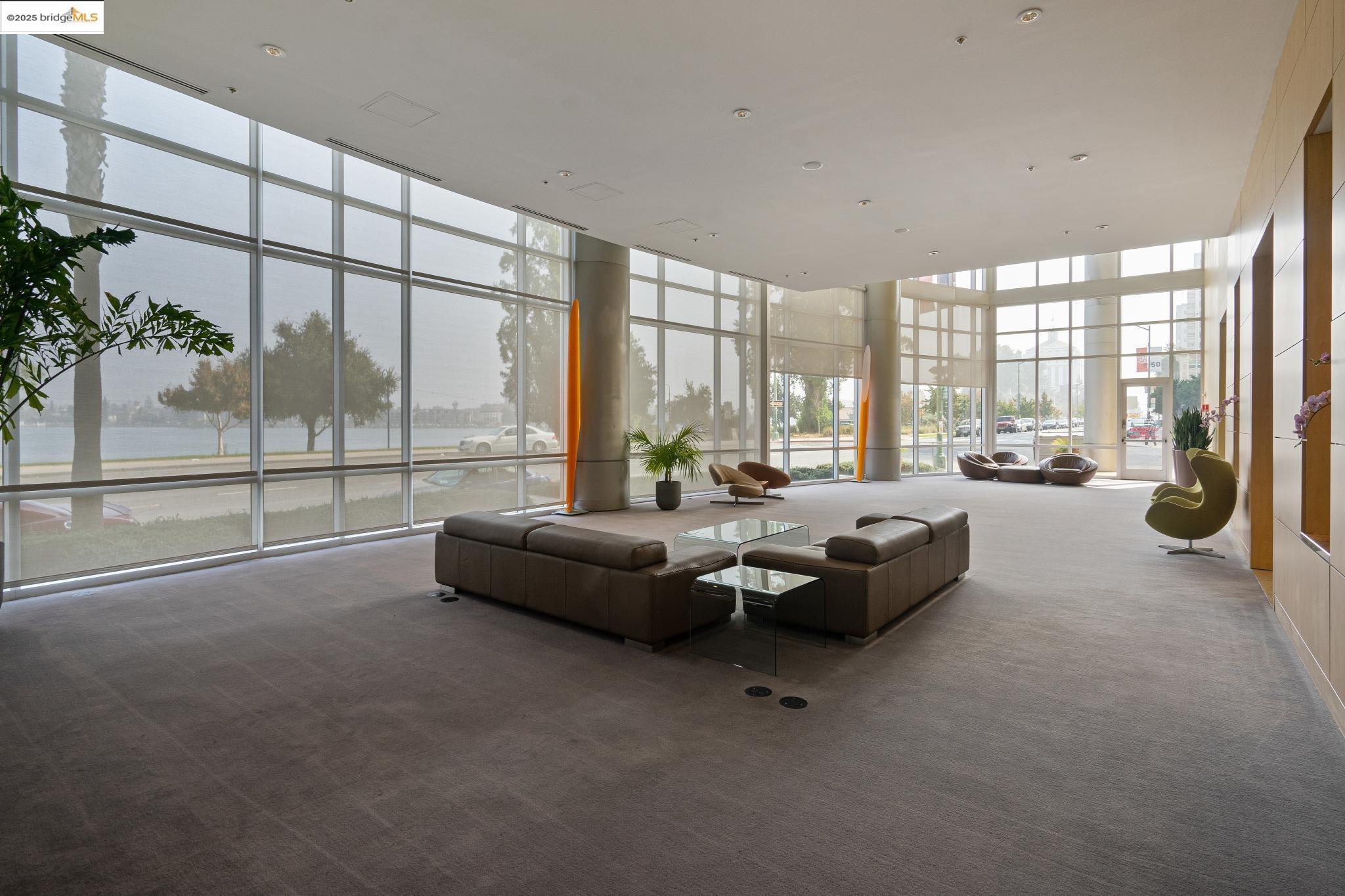 1 Lakeside Drive, Unit 1010 Oakland, CA 94612 - Photo 39 of 47 Lobby with a wall of windows and a towering ceiling