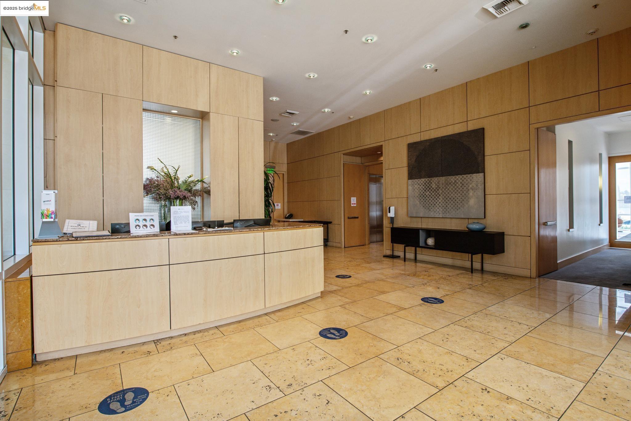 1 Lakeside Drive, Unit 1010 Oakland, CA 94612 - Photo 47 of 47 Welcome area featuring recessed lighting and wood walls