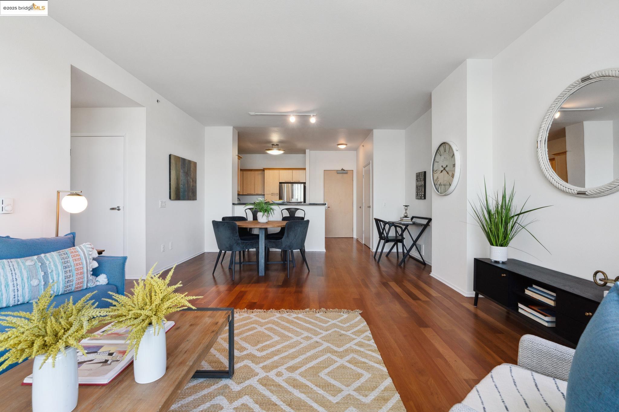 1 Lakeside Drive, Unit 1010 Oakland, CA 94612 - Photo 7 of 47 Living room with dark wood-style floors