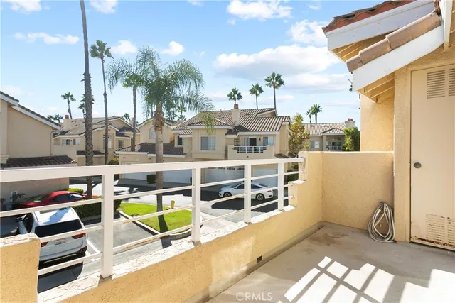 a view of a two chairs in the patio