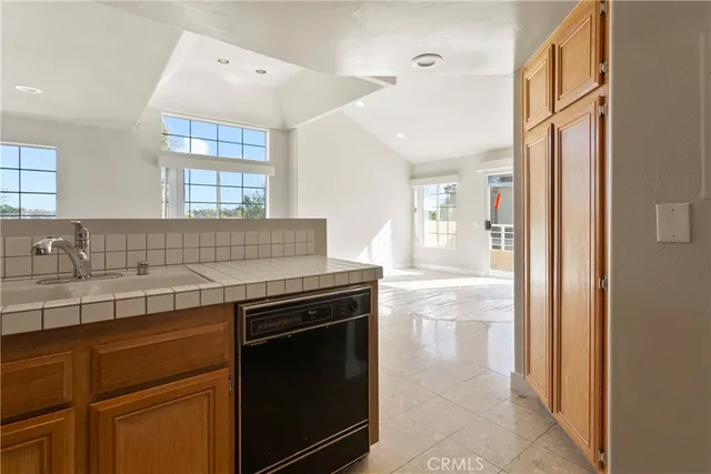 a kitchen with stainless steel appliances granite countertop a stove and a sink