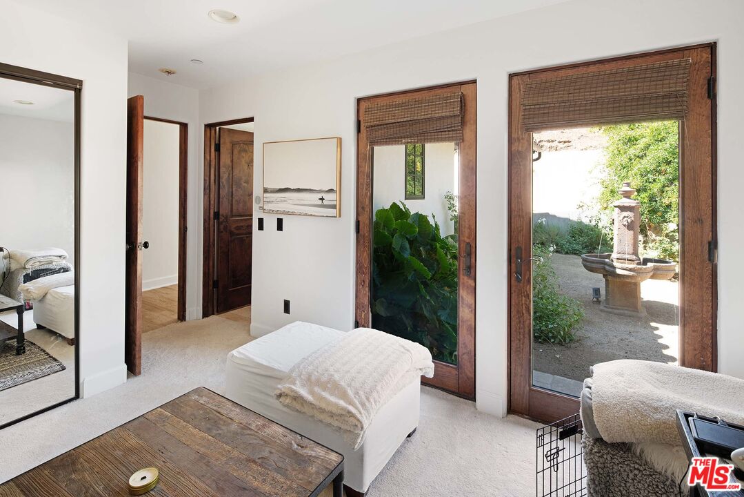 2251 Cold Canyon Road Calabasas, CA 91302 - Photo 23 of 47 a bedroom with a bed and a window