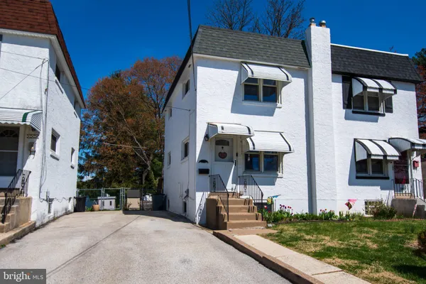 a front view of a house with many windows