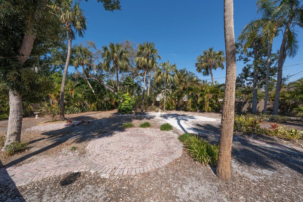 240 President Street Dunedin, FL 34698 - Photo 8 of 19 a view of a yard with plants