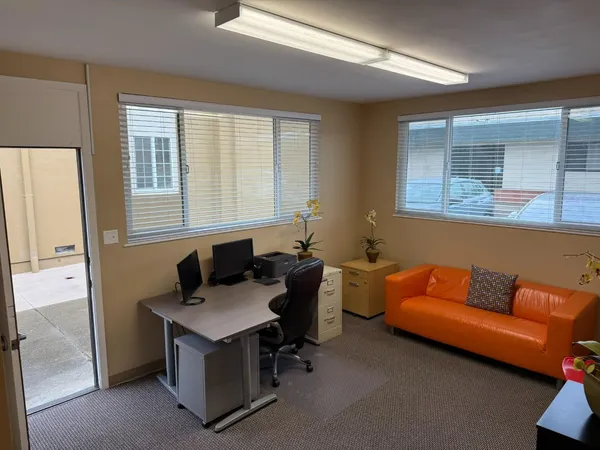 a living room with furniture and windows