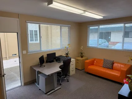 a living room with furniture and windows