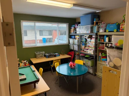 a room with furniture and a book shelf