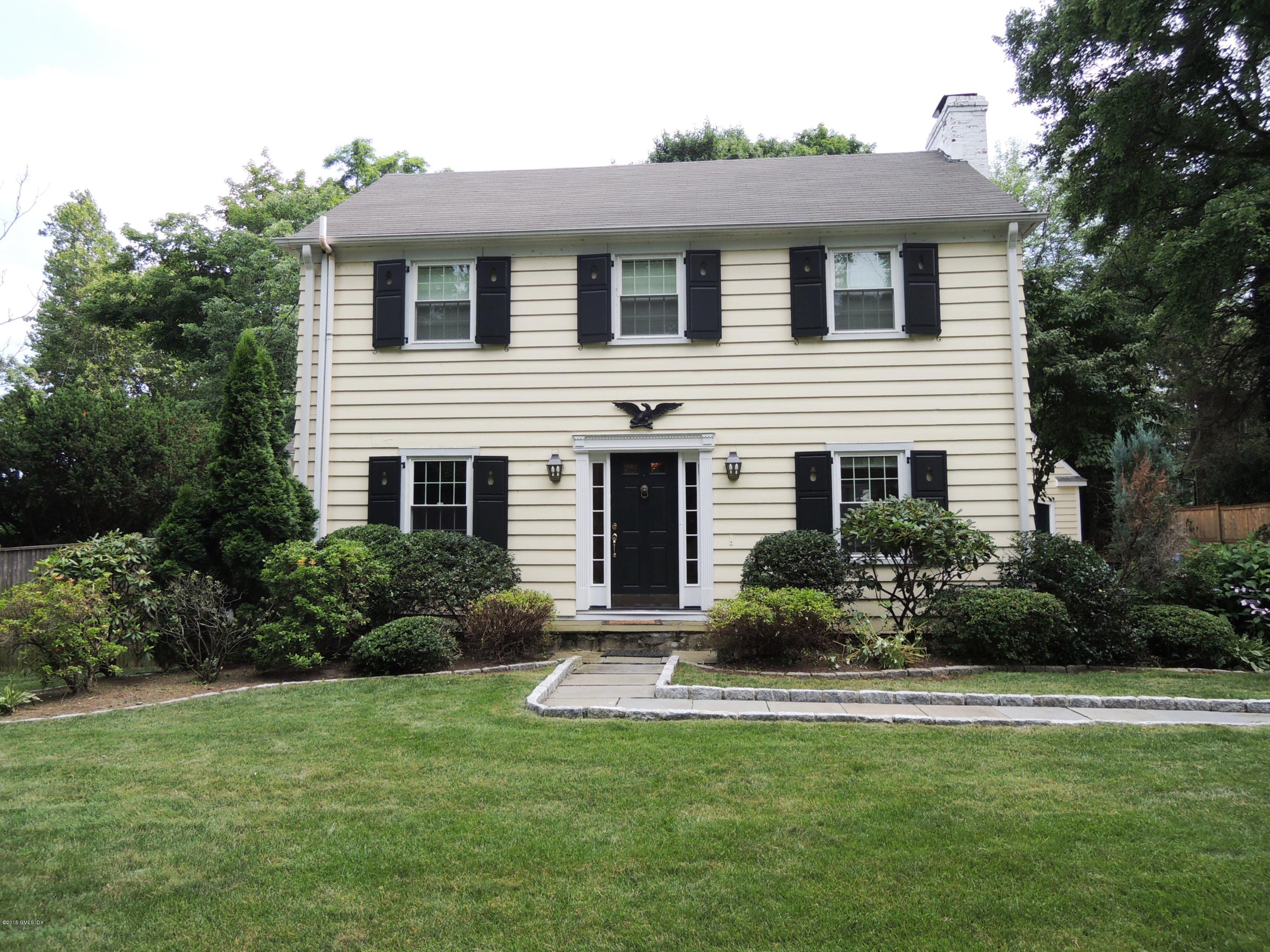 2 Cat Rock Road Cos Cob, CT 06807 - Photo 1 of 42 a front view of a house with a yard and potted plants