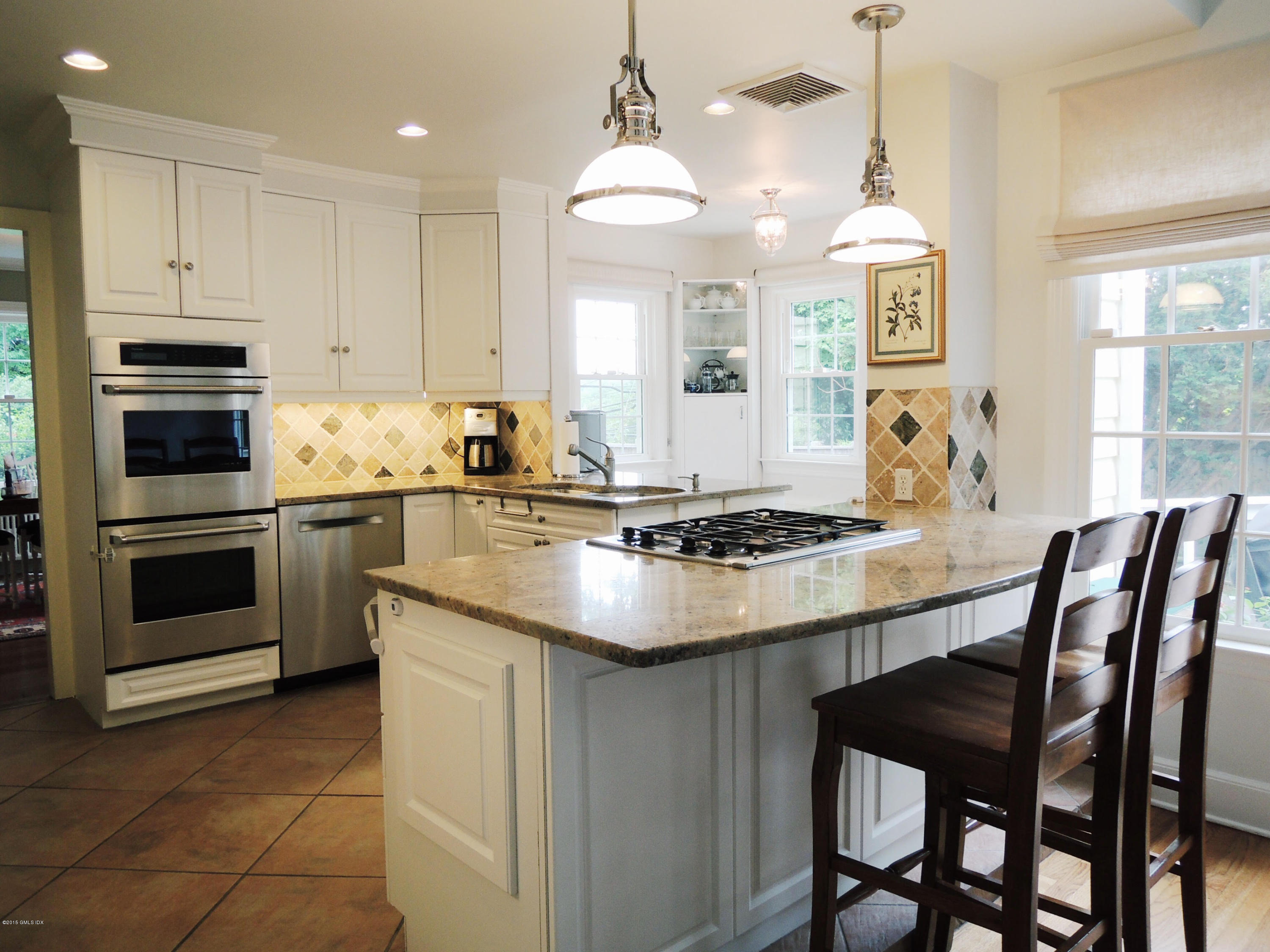 2 Cat Rock Road Cos Cob, CT 06807 - Photo 11 of 42 a kitchen with granite countertop a sink stove and refrigerator