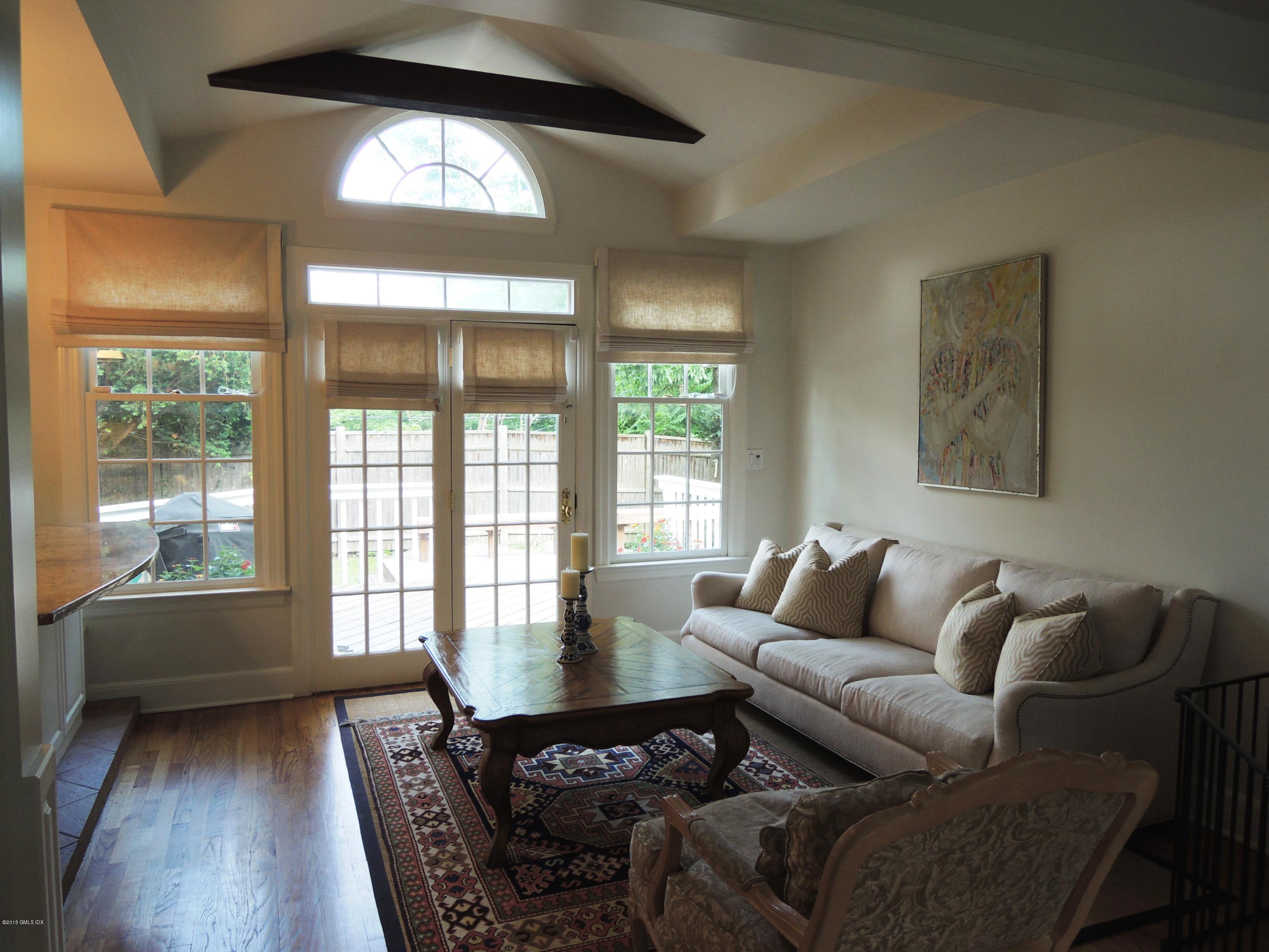 2 Cat Rock Road Cos Cob, CT 06807 - Photo 38 of 42 a living room with furniture and a large window