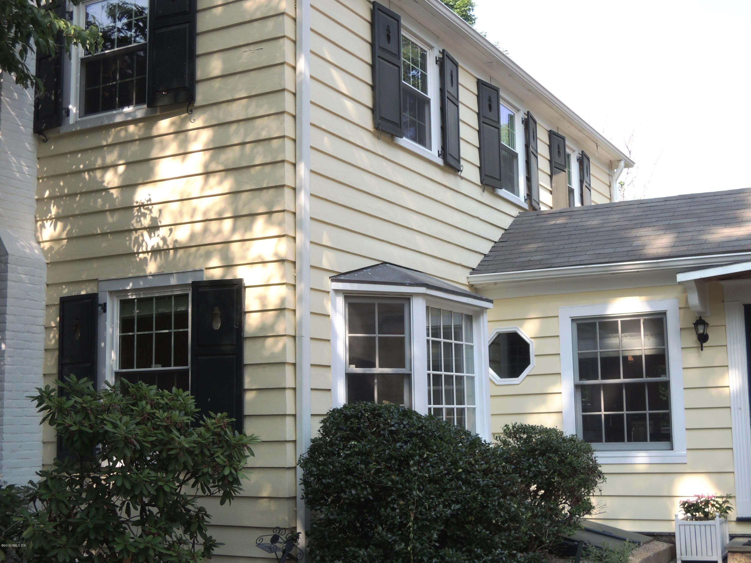 2 Cat Rock Road Cos Cob, CT 06807 - Photo 6 of 42 a front view of a house with a yard