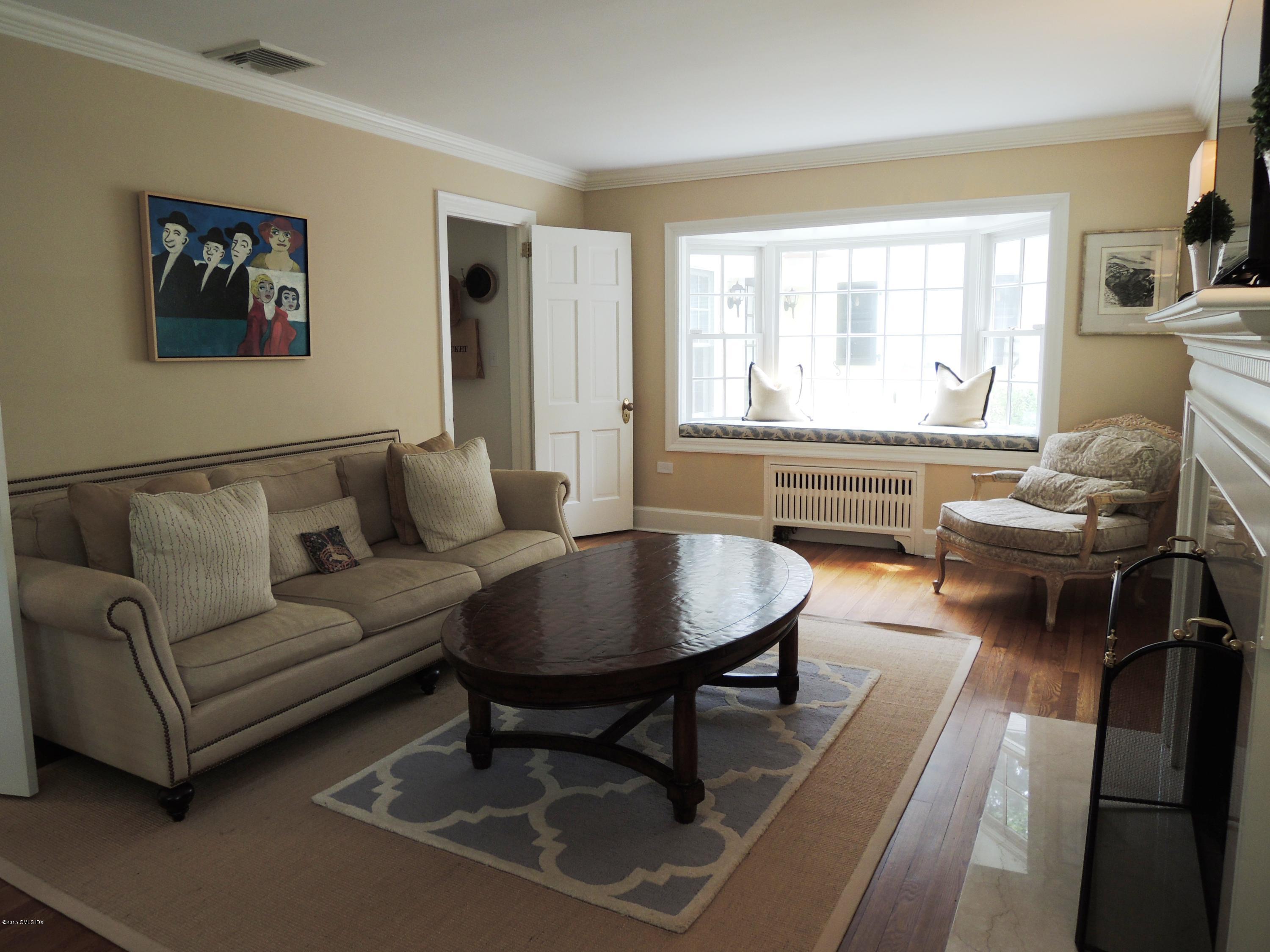 2 Cat Rock Road Cos Cob, CT 06807 - Photo 8 of 42 a living room with furniture and a large window