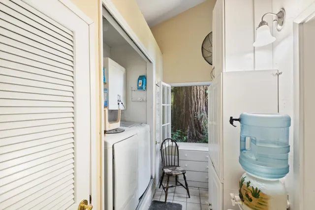 a bathroom with a sink a toilet a mirror and a tub