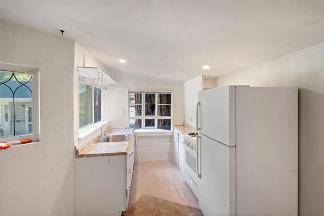 a view of empty room with windows