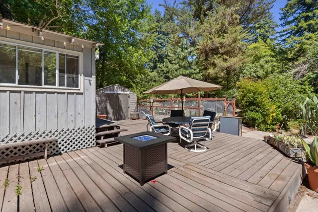 a big house with large trees and plants