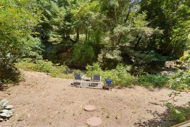 a view of a house with porch and furniture
