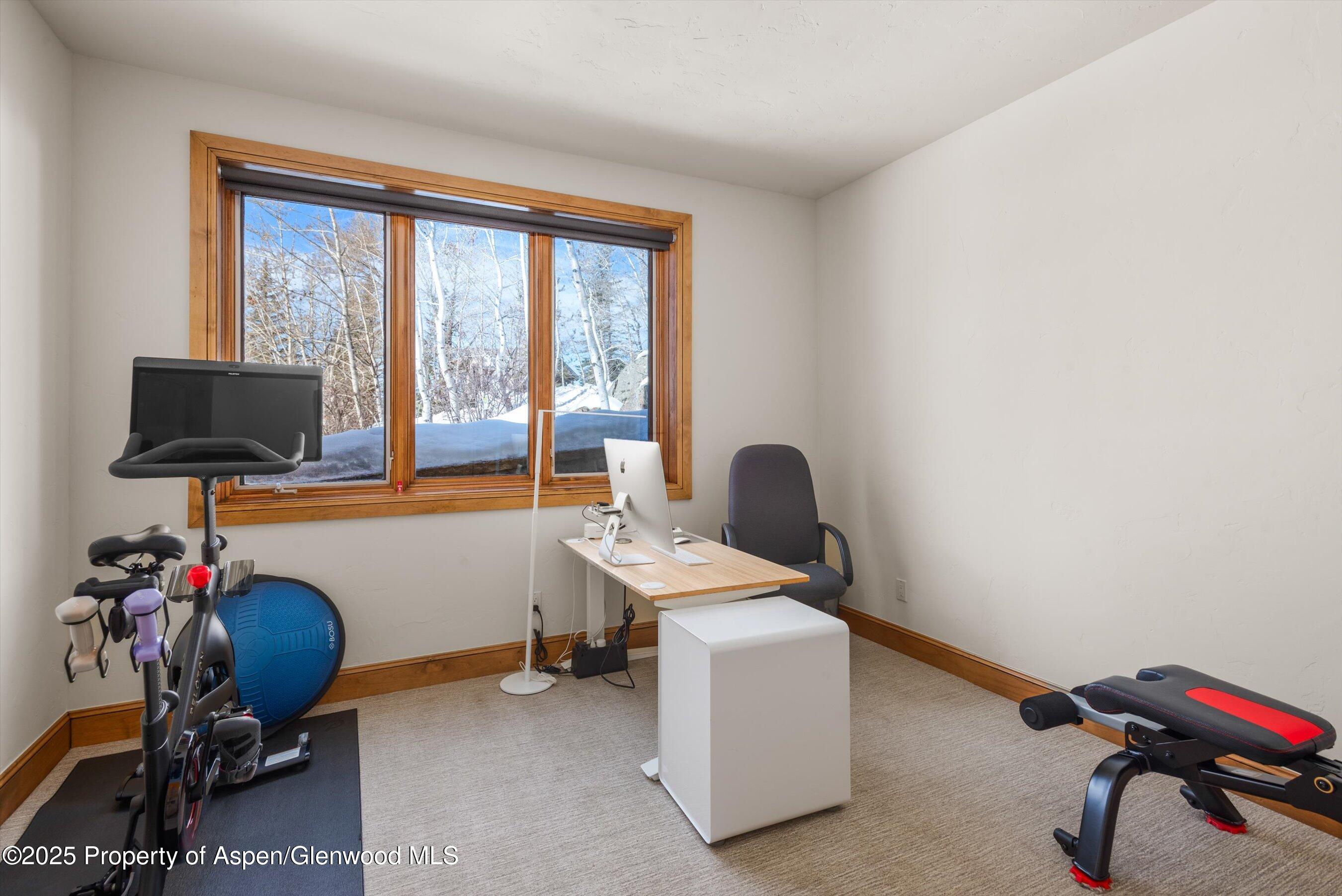 415 Silverlode Drive Aspen, CO 81611 - Photo 21 of 26 a view of a workspace with furniture and a window