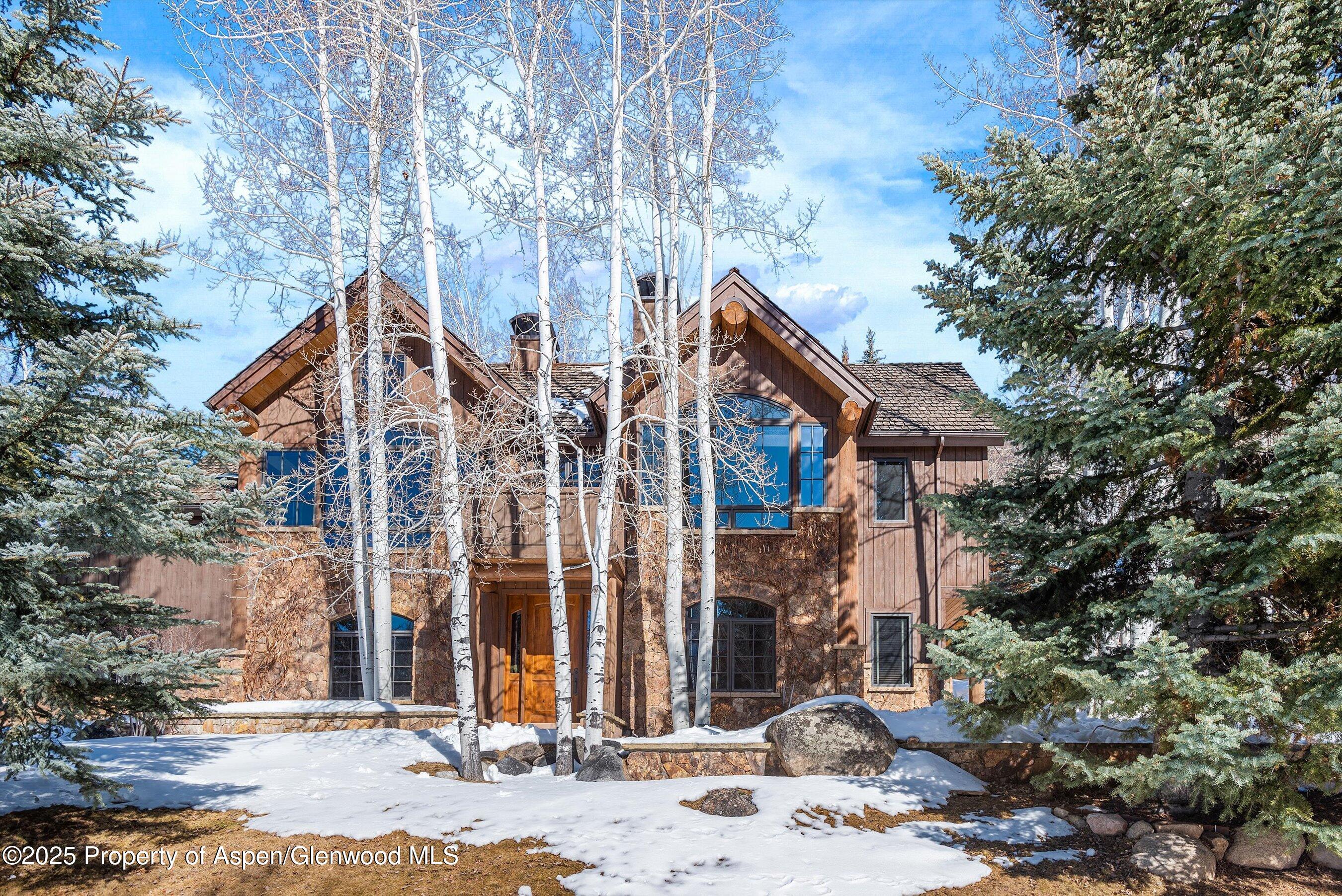 415 Silverlode Drive Aspen, CO 81611 - Photo 22 of 26 a front view of a house with a yard