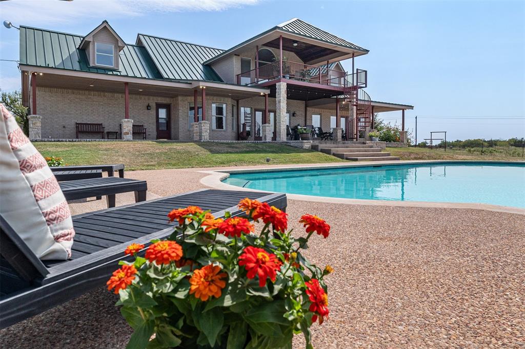 a front view of a house with swimming pool