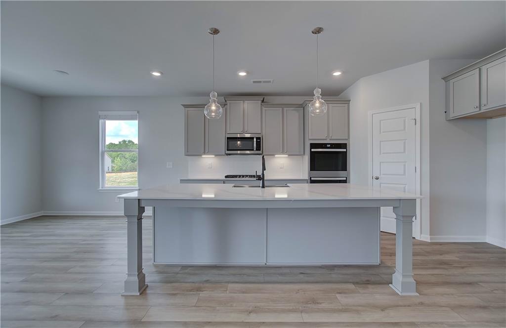 100 Felicity Pike Locust Grove, GA 30248 - Photo 15 of 38 a view of kitchen with stainless steel appliances refrigerator sink and cabinets
