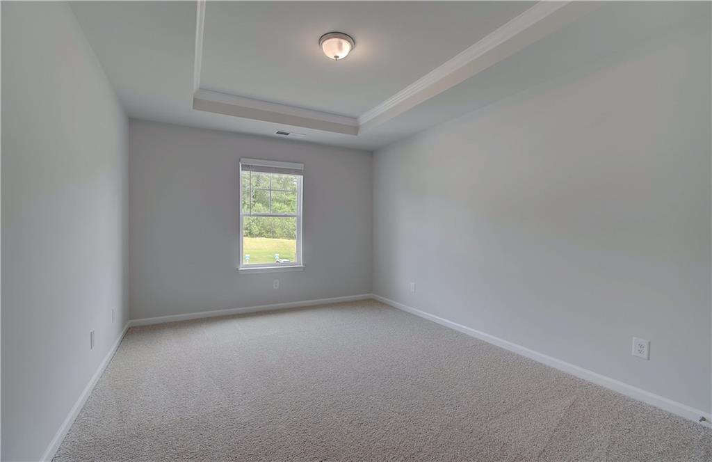 100 Felicity Pike Locust Grove, GA 30248 - Photo 24 of 38 an empty room with a window