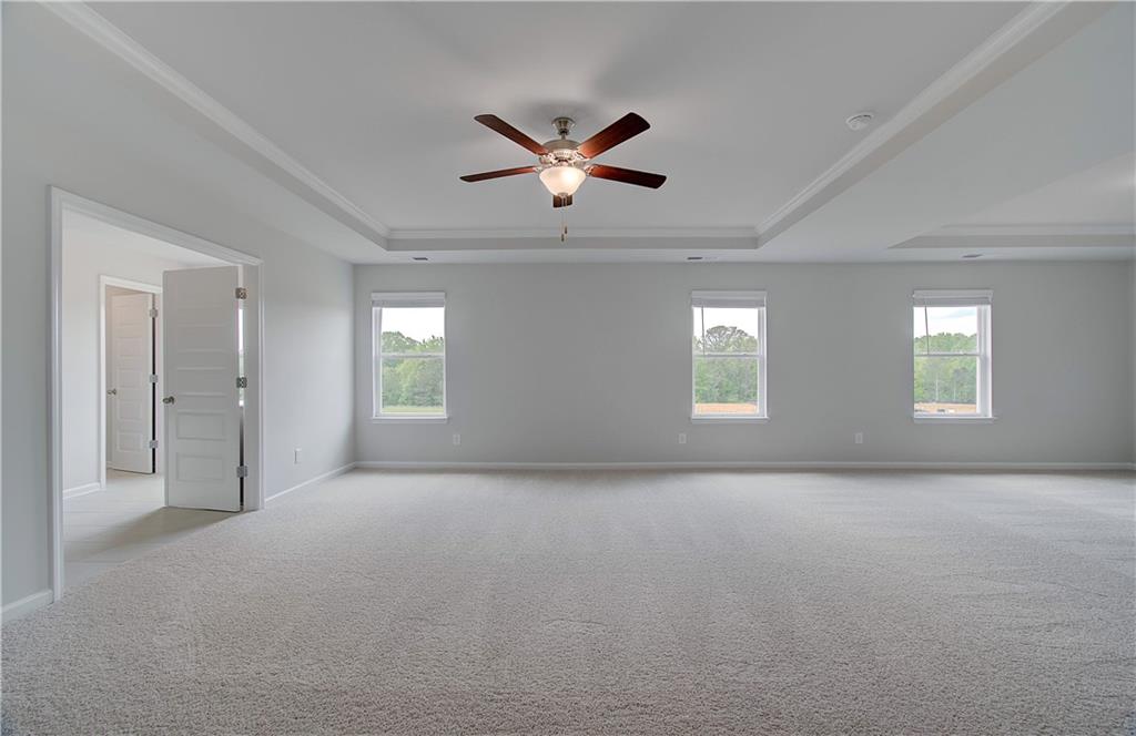 100 Felicity Pike Locust Grove, GA 30248 - Photo 30 of 38 a view of a livingroom with a ceiling fan and window