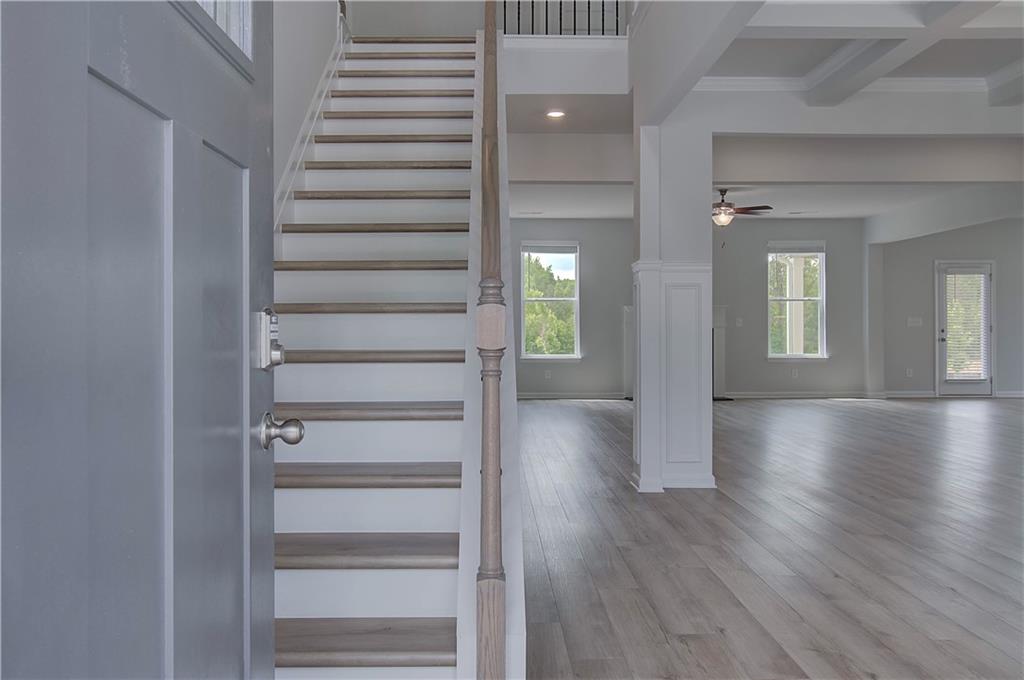 100 Felicity Pike Locust Grove, GA 30248 - Photo 5 of 38 a view of a hallway with wooden floor windows and stairs