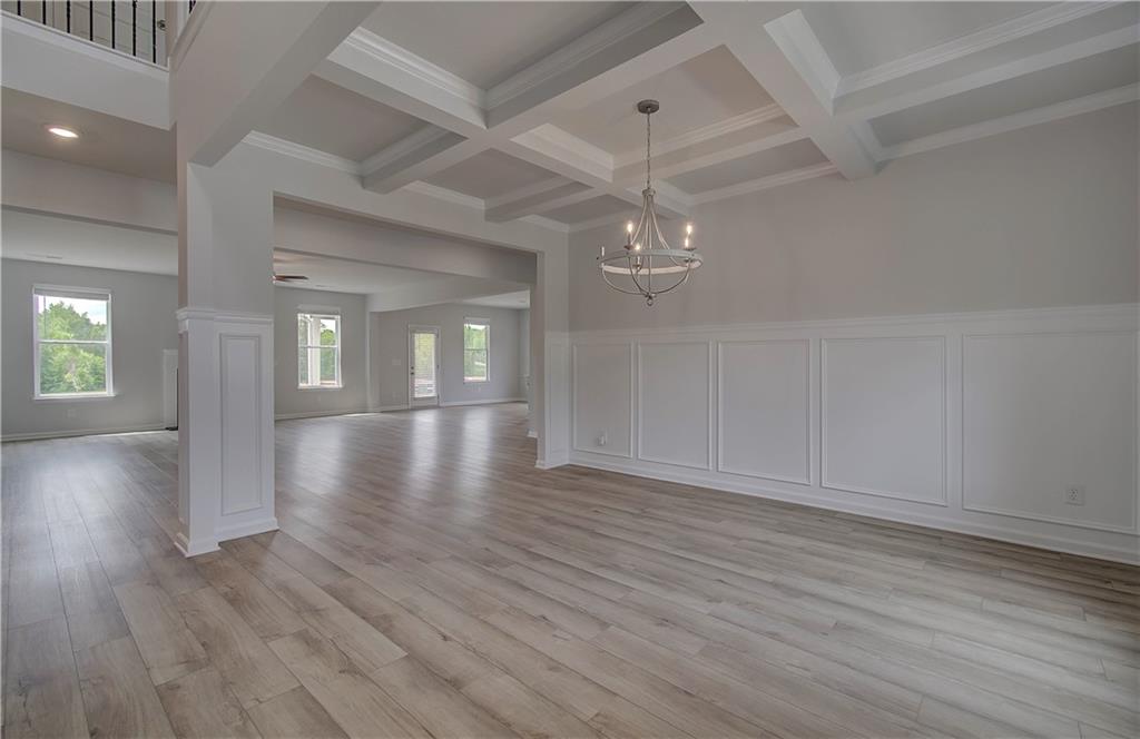 100 Felicity Pike Locust Grove, GA 30248 - Photo 7 of 38 wooden floor in an empty room with a window