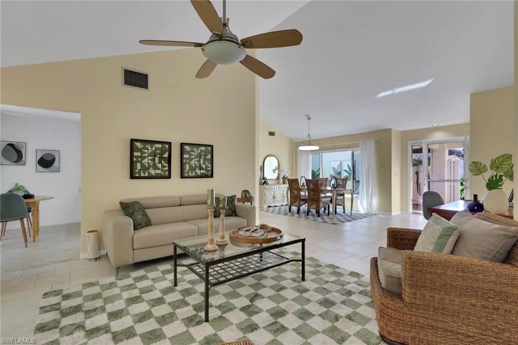 796 Reef Point Circle Naples, FL 34108 - Photo 11 of 37 a living room with furniture and a rug