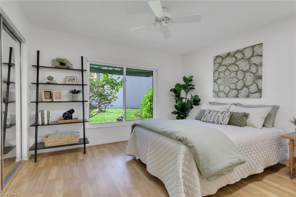796 Reef Point Circle Naples, FL 34108 - Photo 19 of 37 a bedroom with a bed and a window