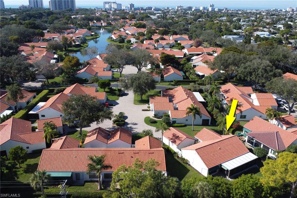 796 Reef Point Circle Naples, FL 34108 - Photo 29 of 37 an aerial view of residential houses with outdoor space
