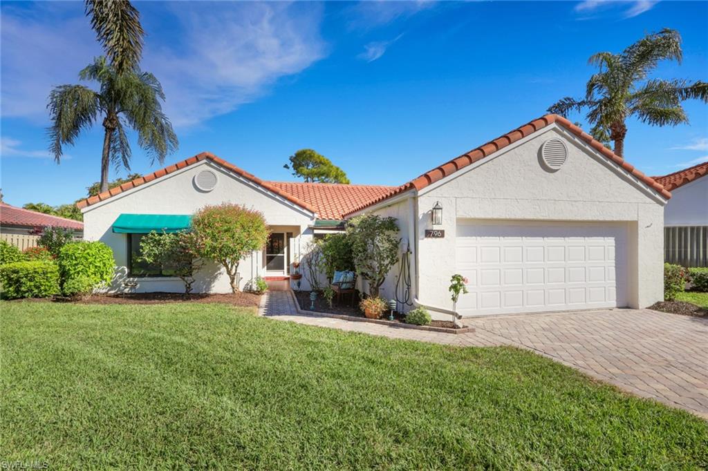 796 Reef Point Circle Naples, FL 34108 - Photo 3 of 37 a view of a house with a yard porch and sitting area