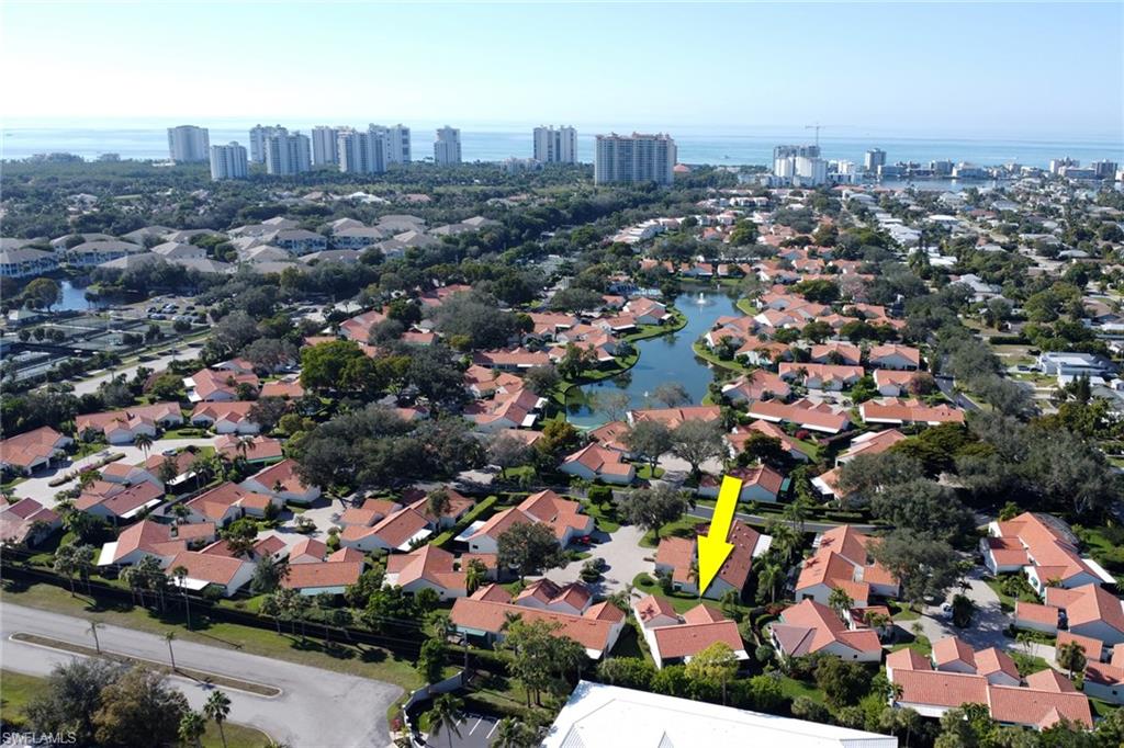 796 Reef Point Circle Naples, FL 34108 - Photo 31 of 37 an aerial view of a city with lots of residential buildings